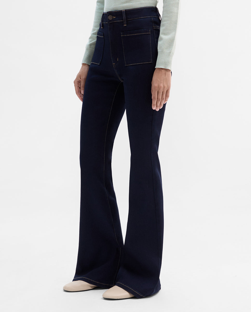 Pantalón vaquero bolsillos parche