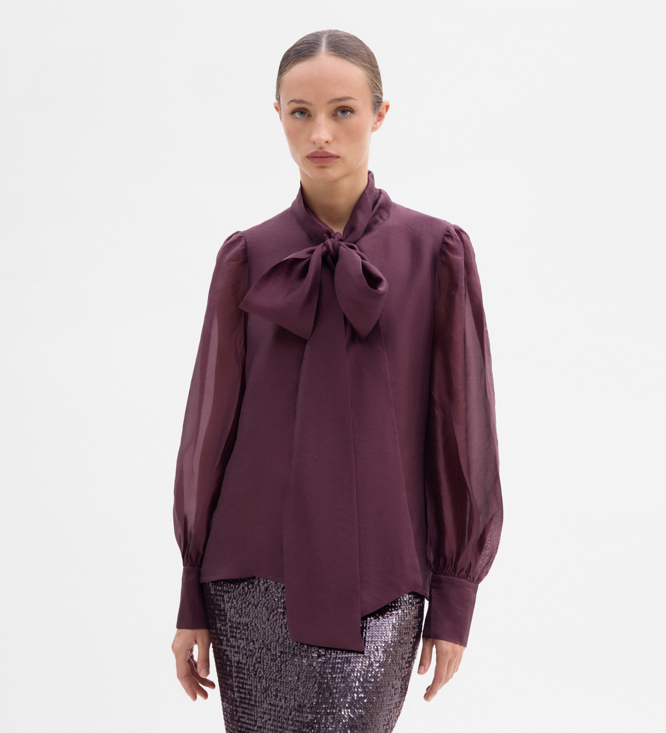 Blouse with a bow neck