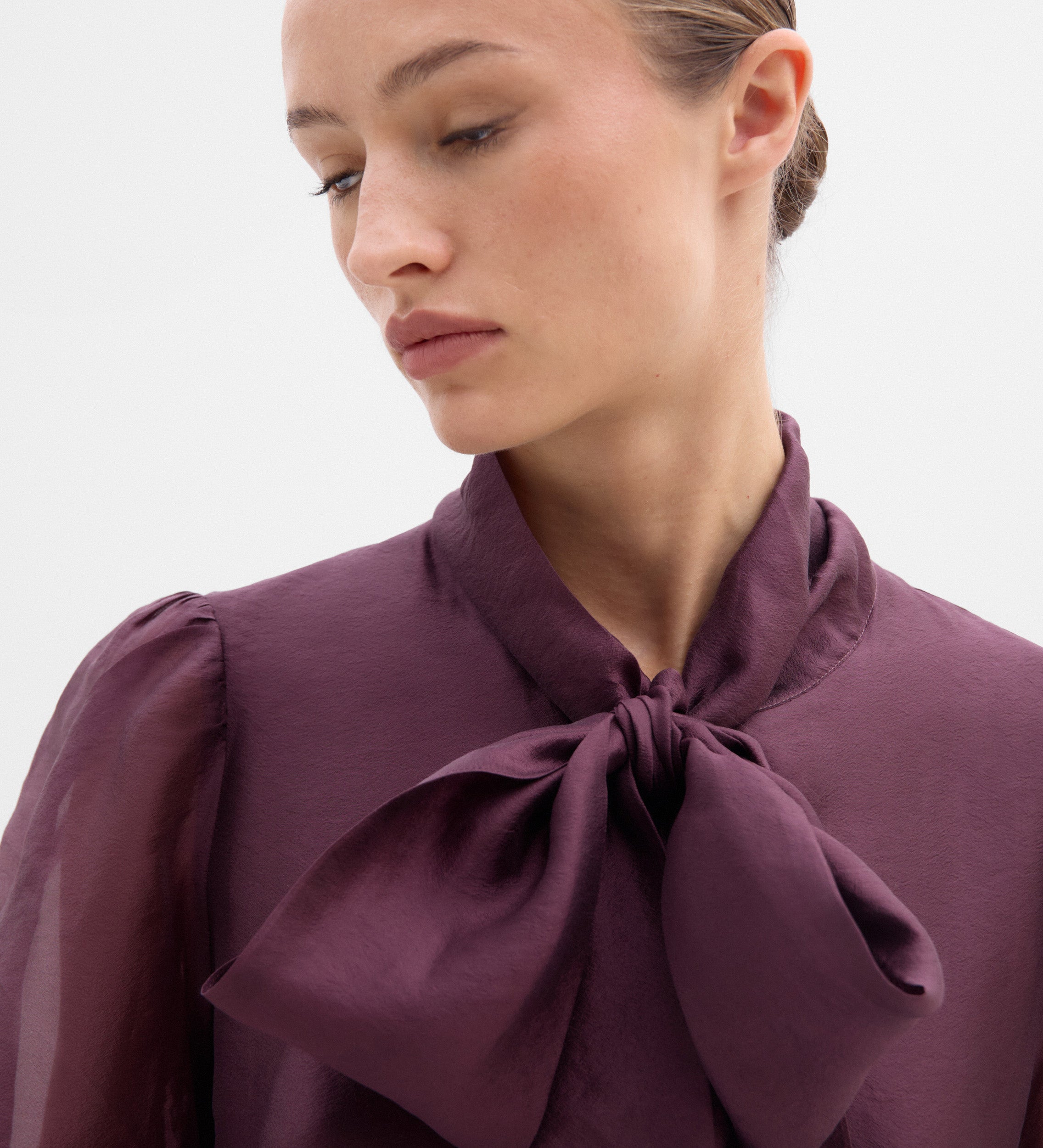 Blouse with a bow neck