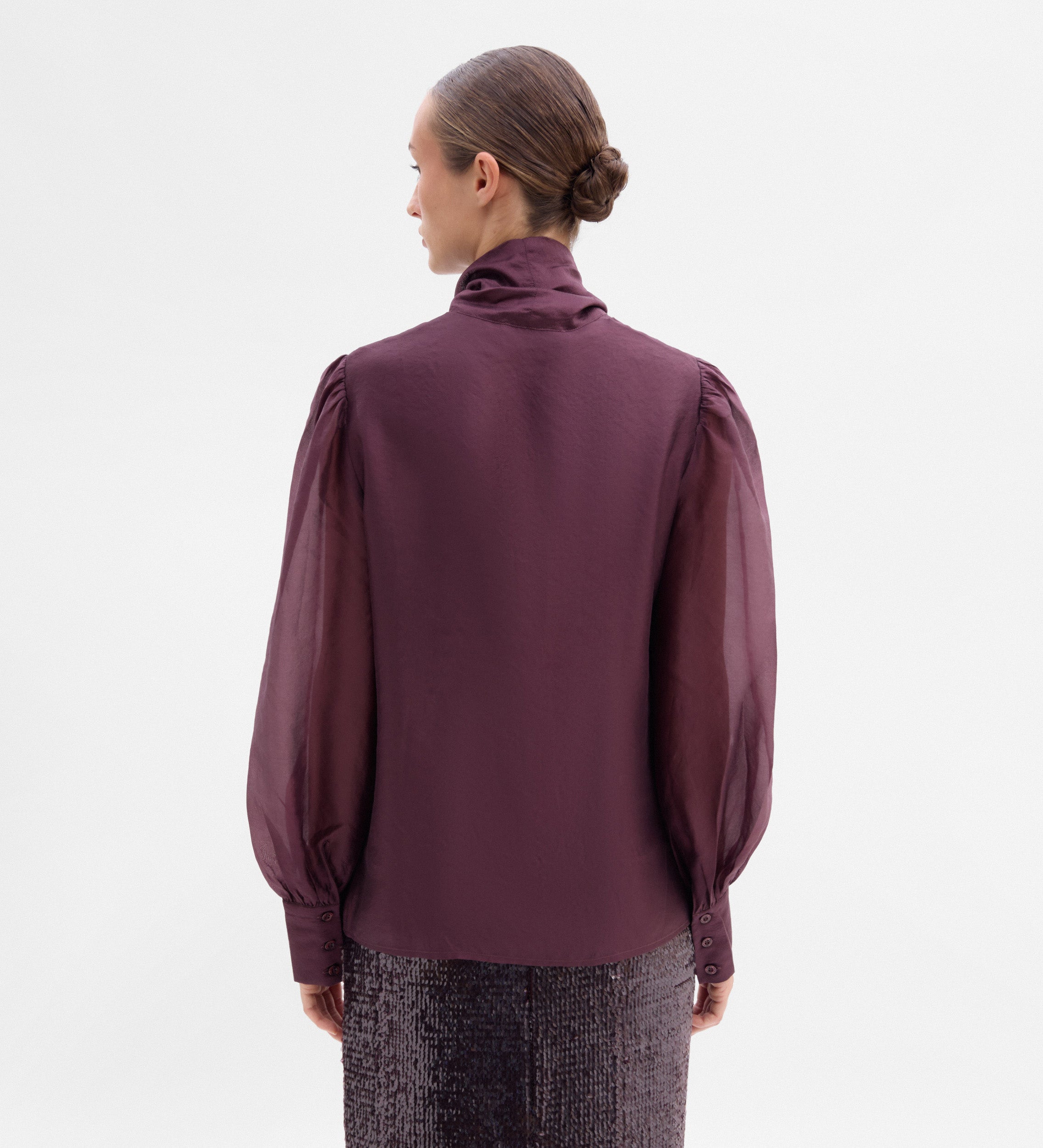 Blouse with a bow neck
