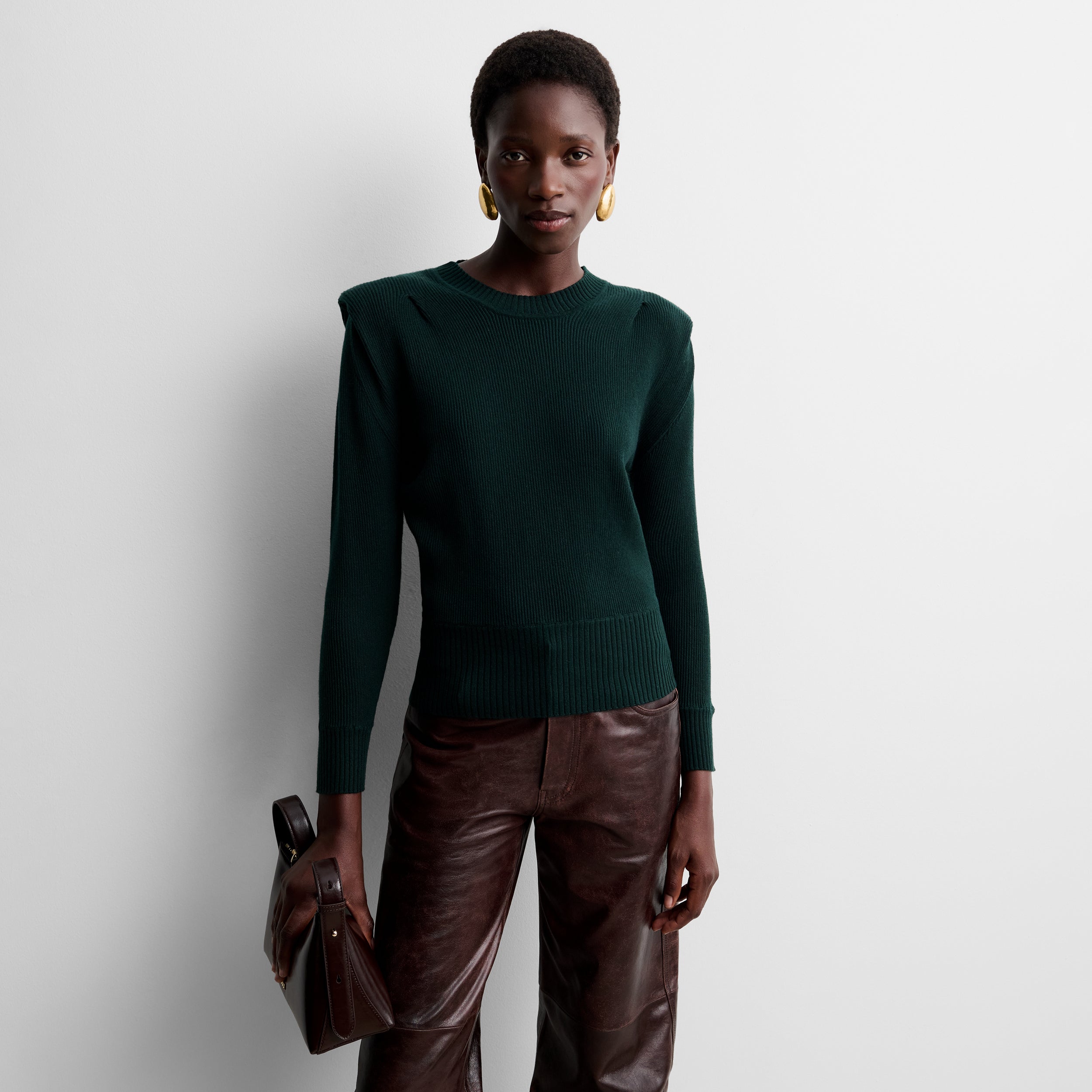 Knit sweater with shoulder pads