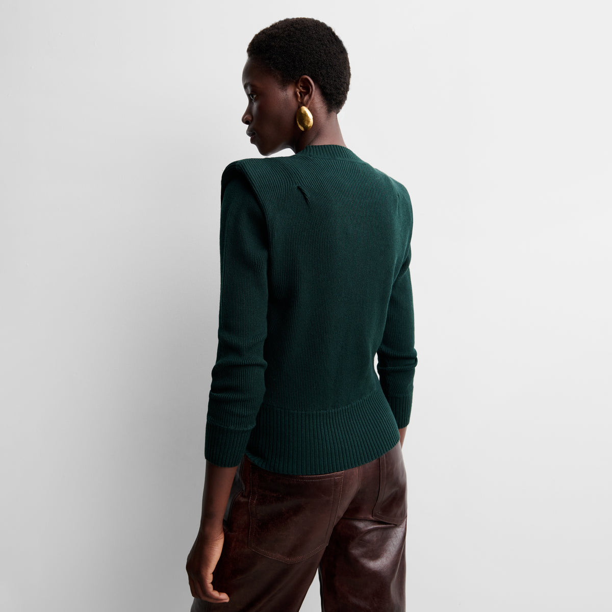 Knit sweater with shoulder pads