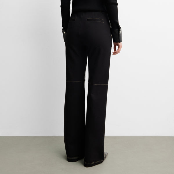Two-material trousers with topstitching