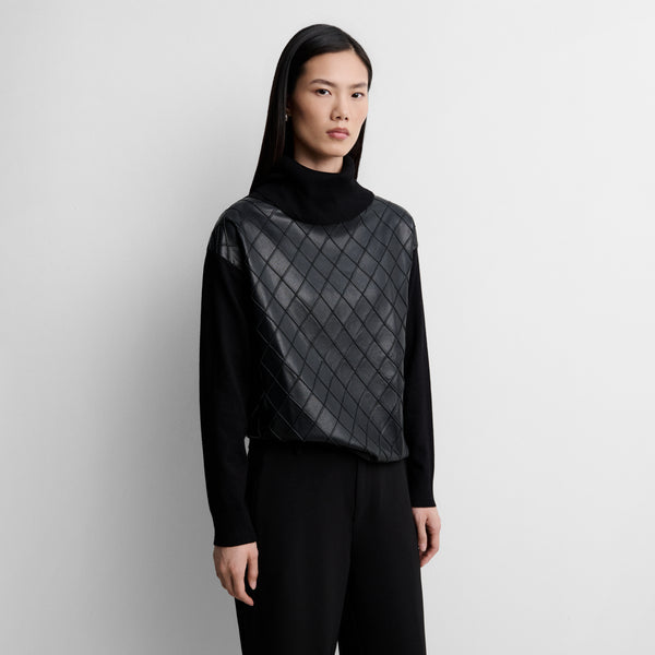 Two-material sweater with diamond pattern