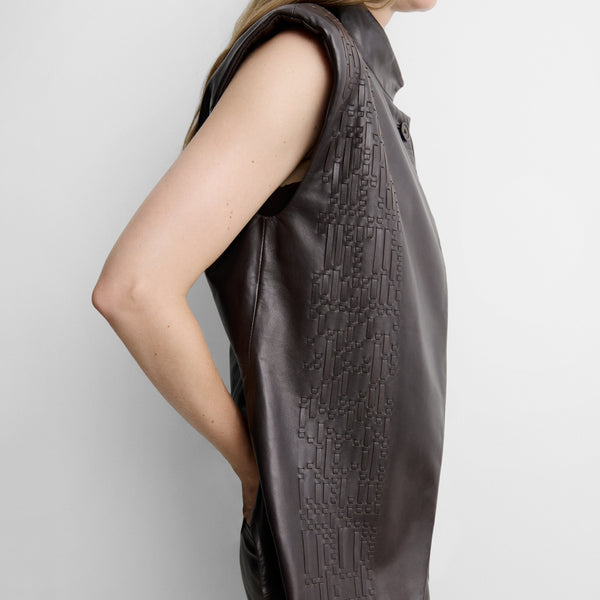 Faux leather gilet with woven straps