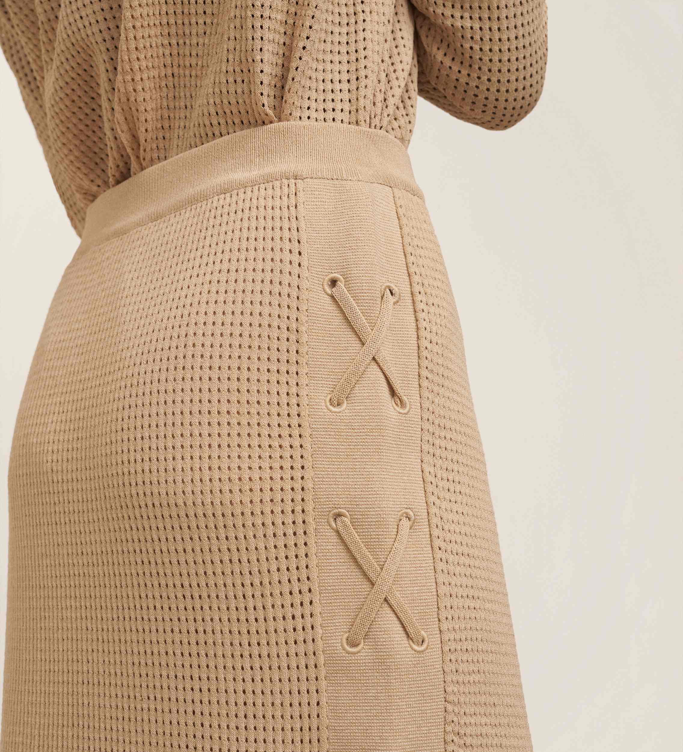 Knitted skirt with laces