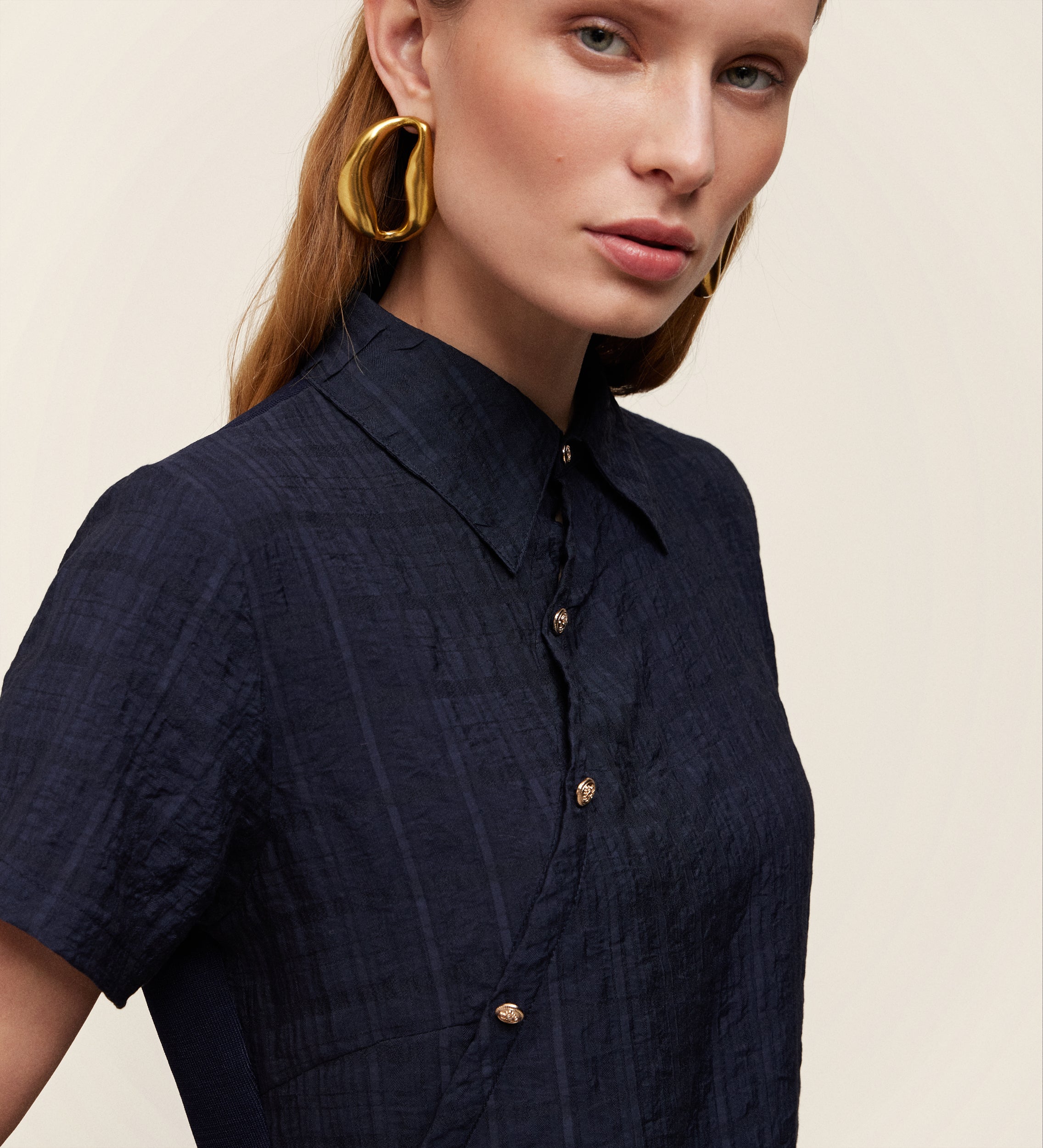 Asymmetrical bi-material knit top